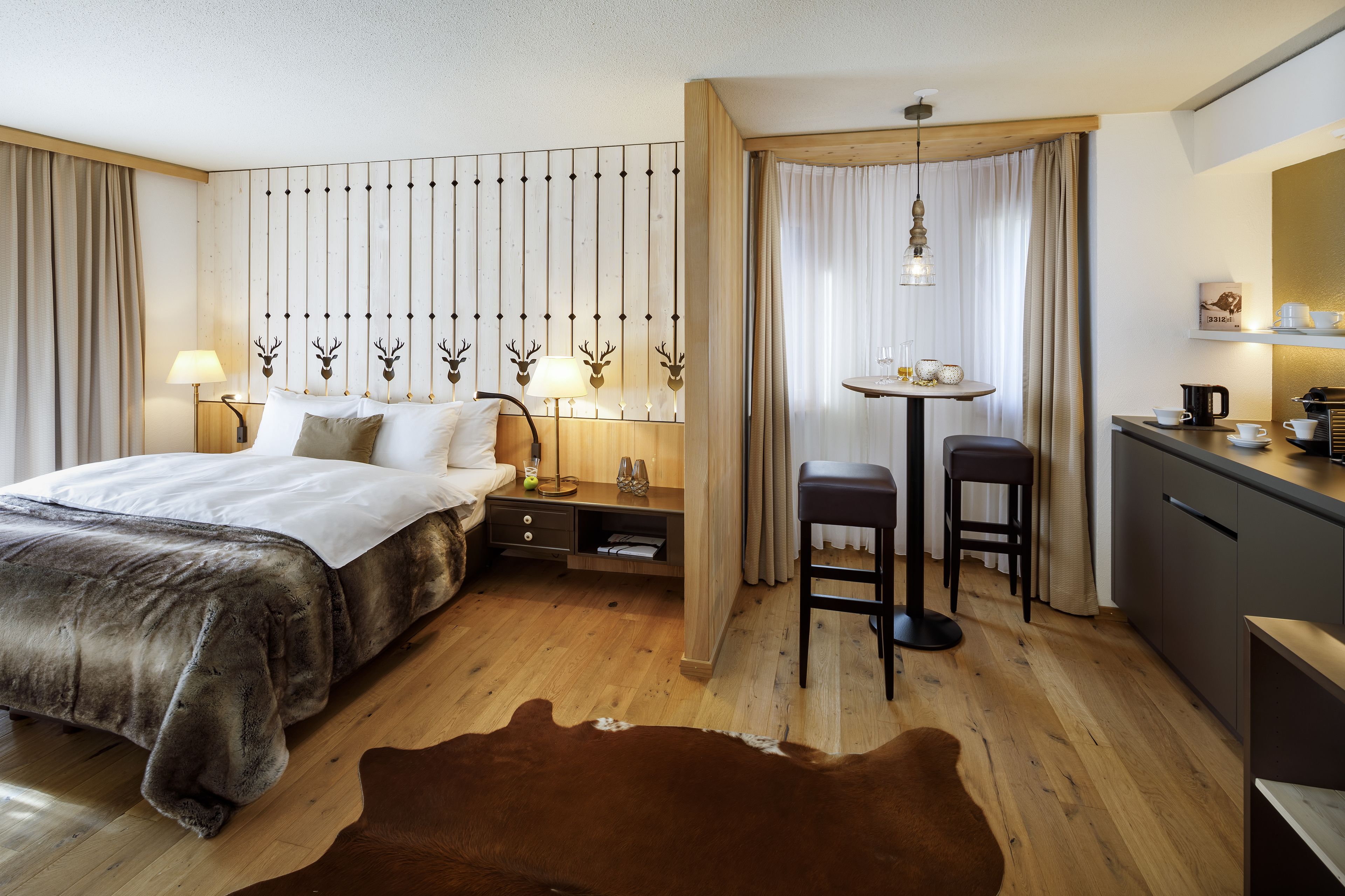 superior studio (alpenchic) | living area | tv