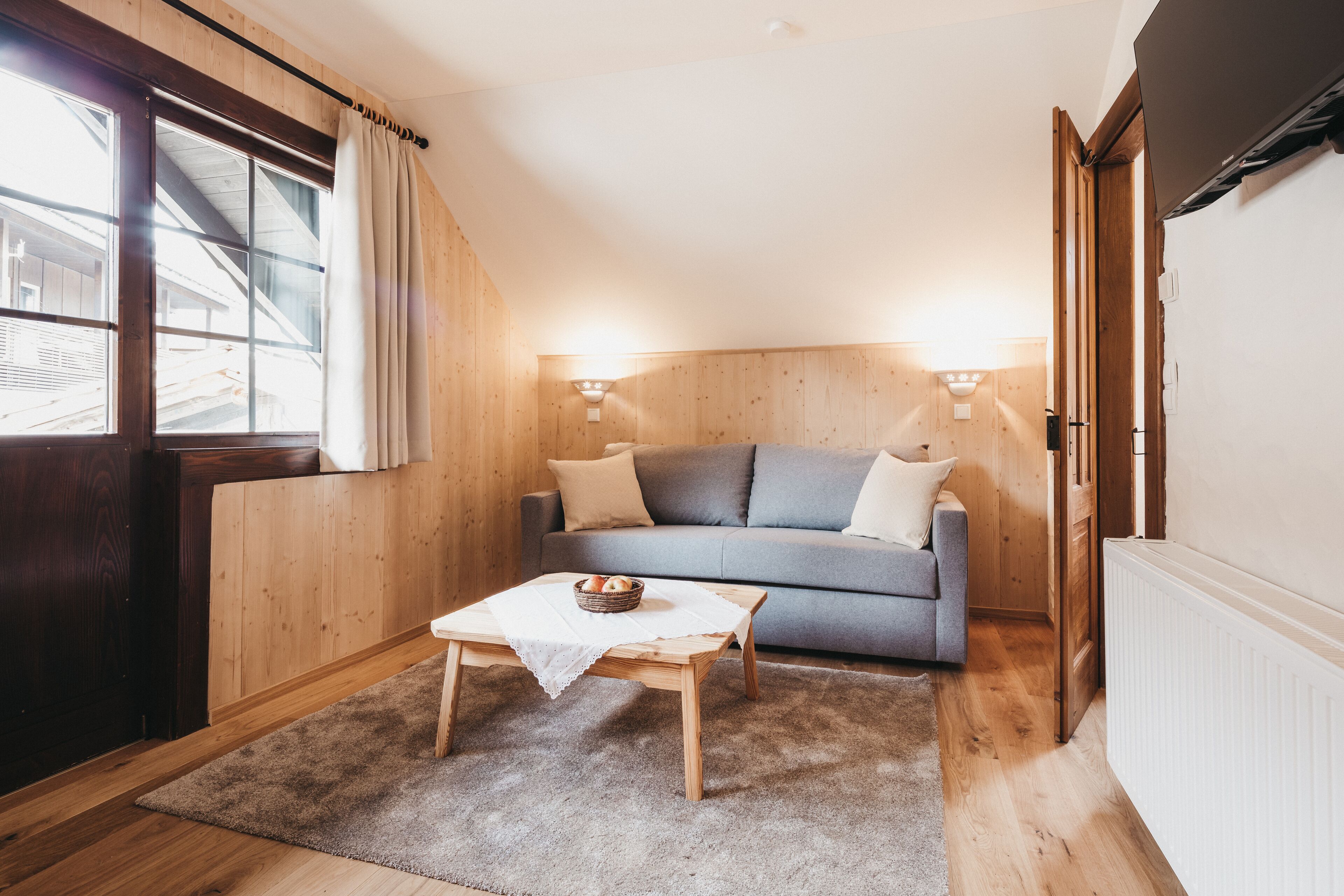 suite, 1 bedroom, balcony ("federleicht" (incl. cleaning fee)) | living area | flat-screen tv, fireplace