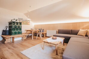 Apartment, 2 Bedrooms ("Felsenfest" (including cleaning fee)) | Living area | Flat-screen TV, fireplace - Naturel Hoteldorf Schönleitn (Finkenstein am Faaker See)