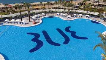 Outdoor pool, pool umbrellas, sun loungers