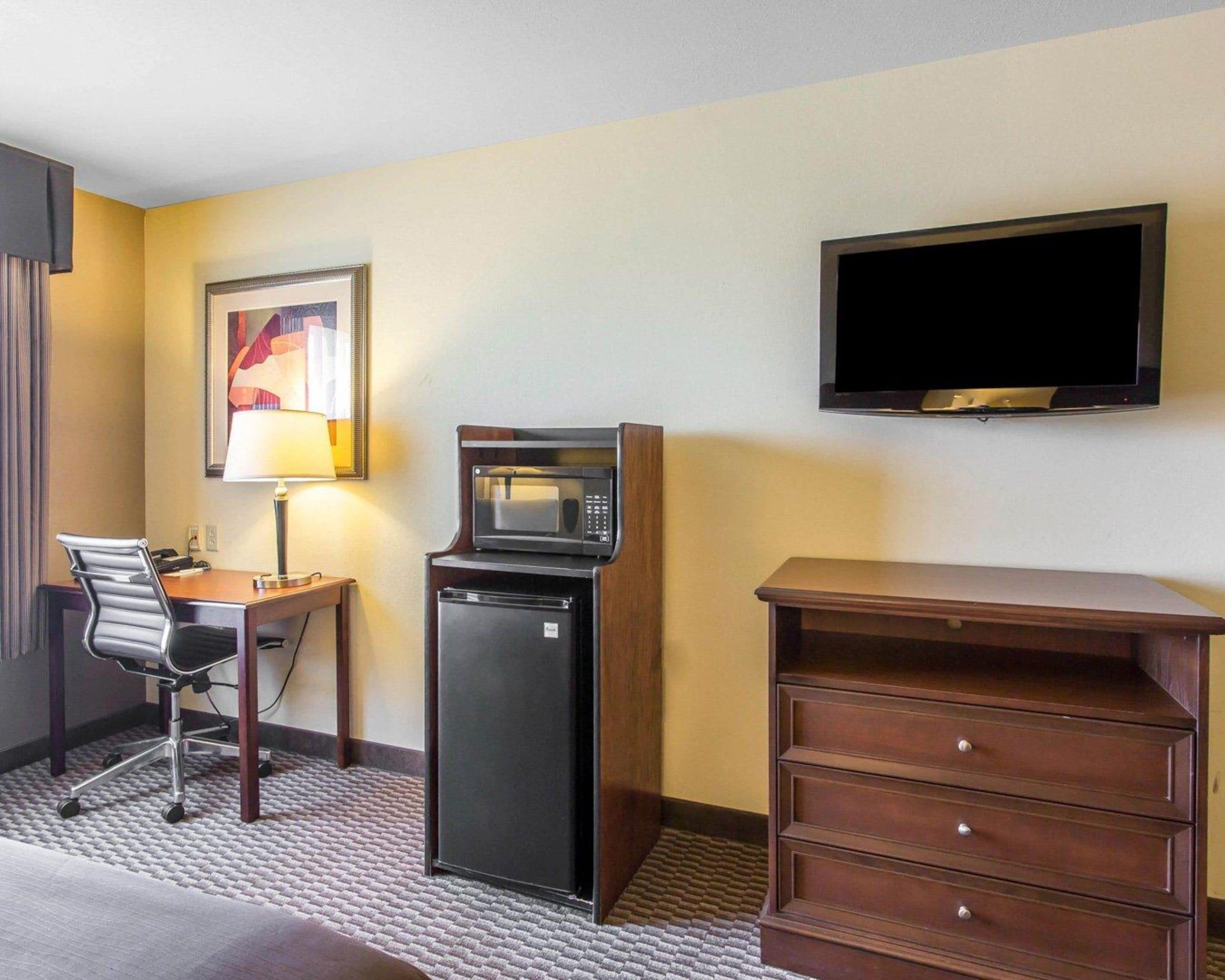 pillow-top beds, desk, laptop workspace, blackout curtains