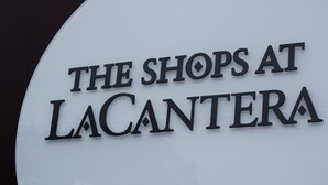 A sign with the text "THE SHOPS AT LACANTERA". - Holiday Inn Express & Suites San Antonio NW near SeaWorld by IHG (San Antonio)