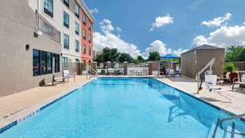 Outdoor pool, open 9:00 AM to 10:00 PM, pool loungers