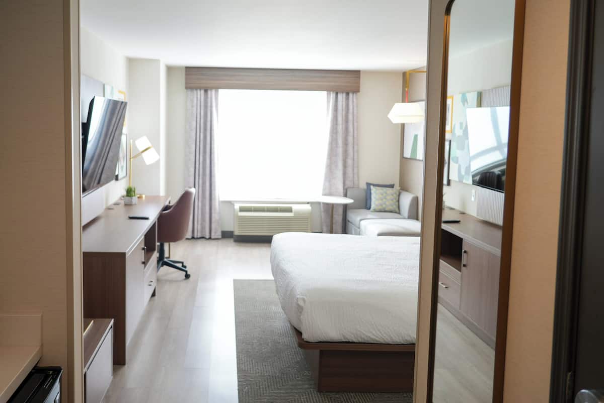 Desk, laptop workspace, blackout drapes, iron/ironing board