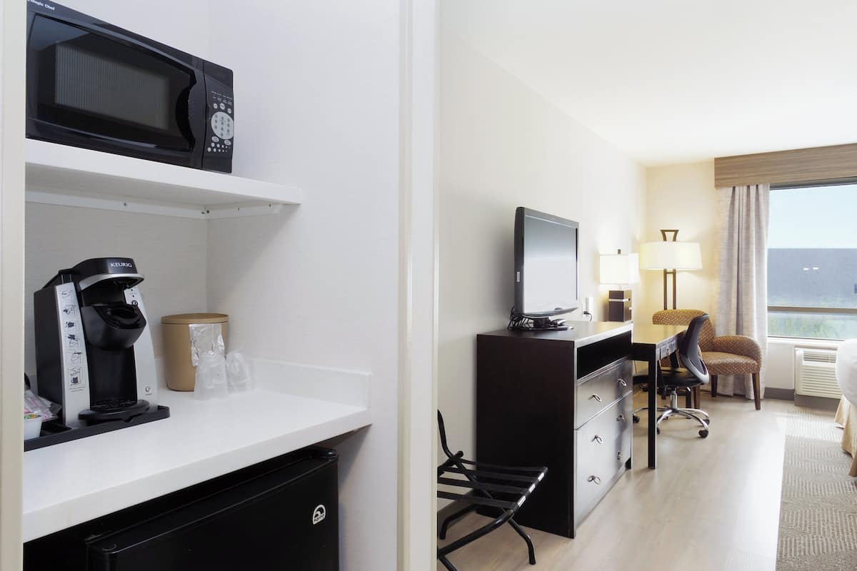 desk, laptop workspace, blackout curtains, iron/ironing board