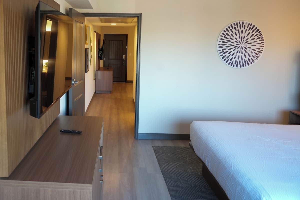 Desk, laptop workspace, blackout drapes, iron/ironing board