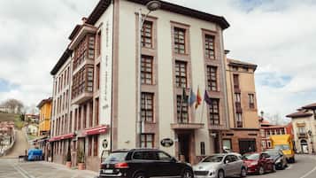 Stunning building with a classic facade, featuring evenly spaced windows and a central entrance.