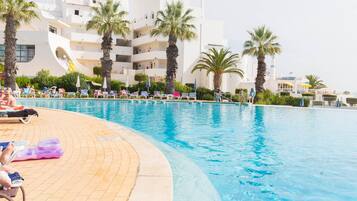 Indoor pool, outdoor pool, pool umbrellas, pool loungers
