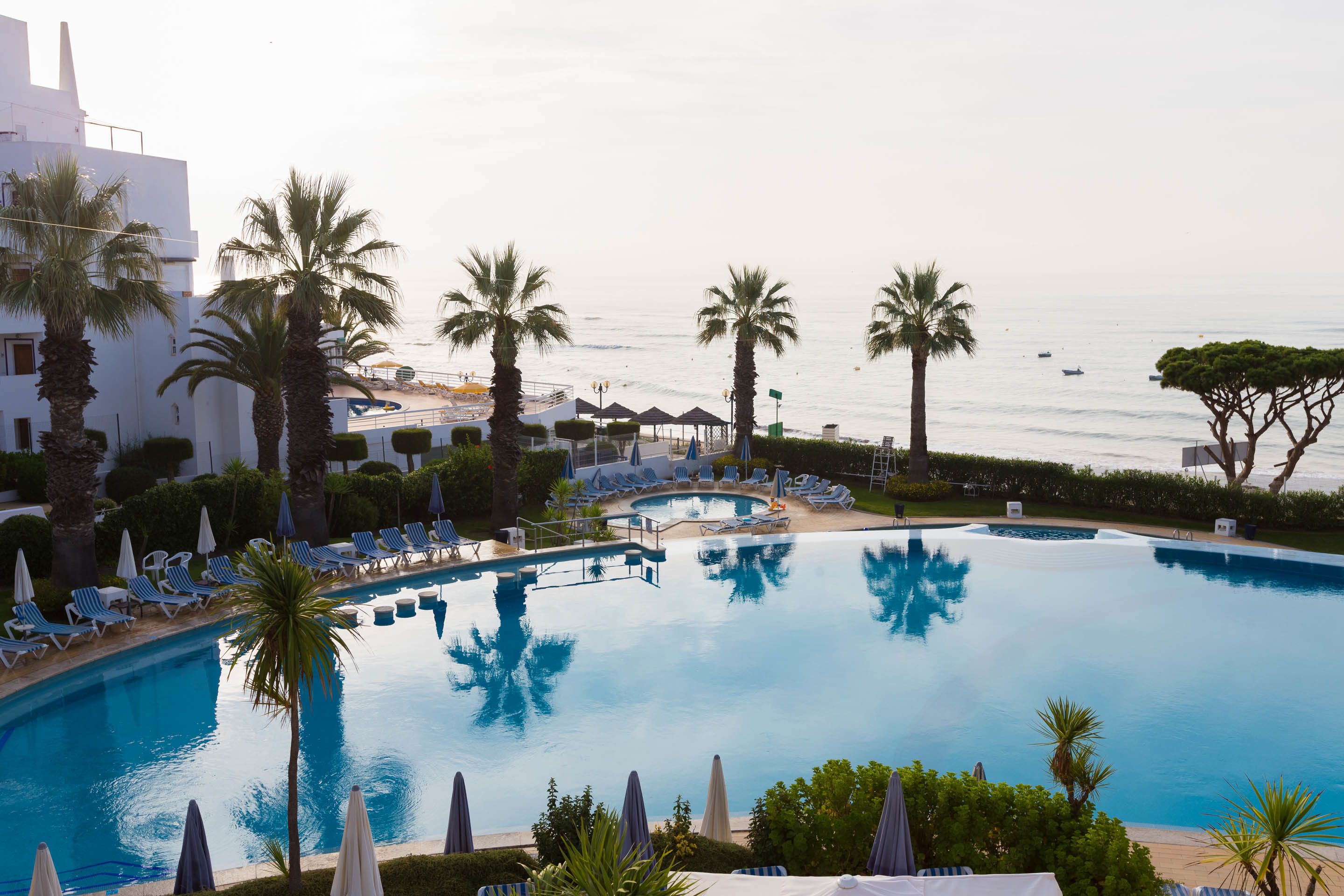 Indoor pool, outdoor pool, pool umbrellas, pool loungers