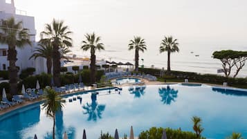 Indoor pool, outdoor pool, pool umbrellas, pool loungers