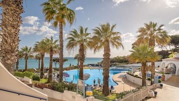 Indoor pool, outdoor pool, pool umbrellas, pool loungers