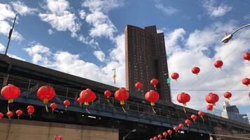 A bridge with red lanterns hanging across it.