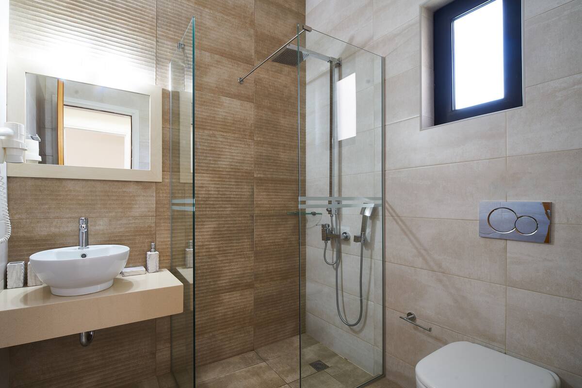 shower, rainfall showerhead, hair dryer, towels