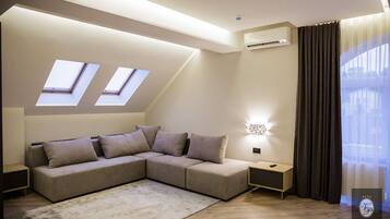 Deluxe Suite, 1 King Bed with Sofa bed | Living area | LCD TV