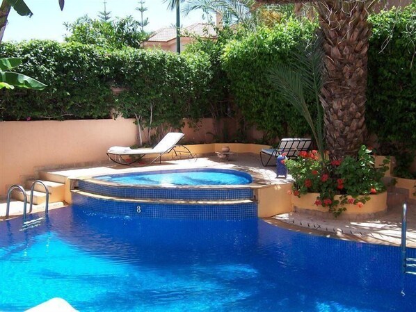 Outdoor pool, pool umbrellas, pool loungers