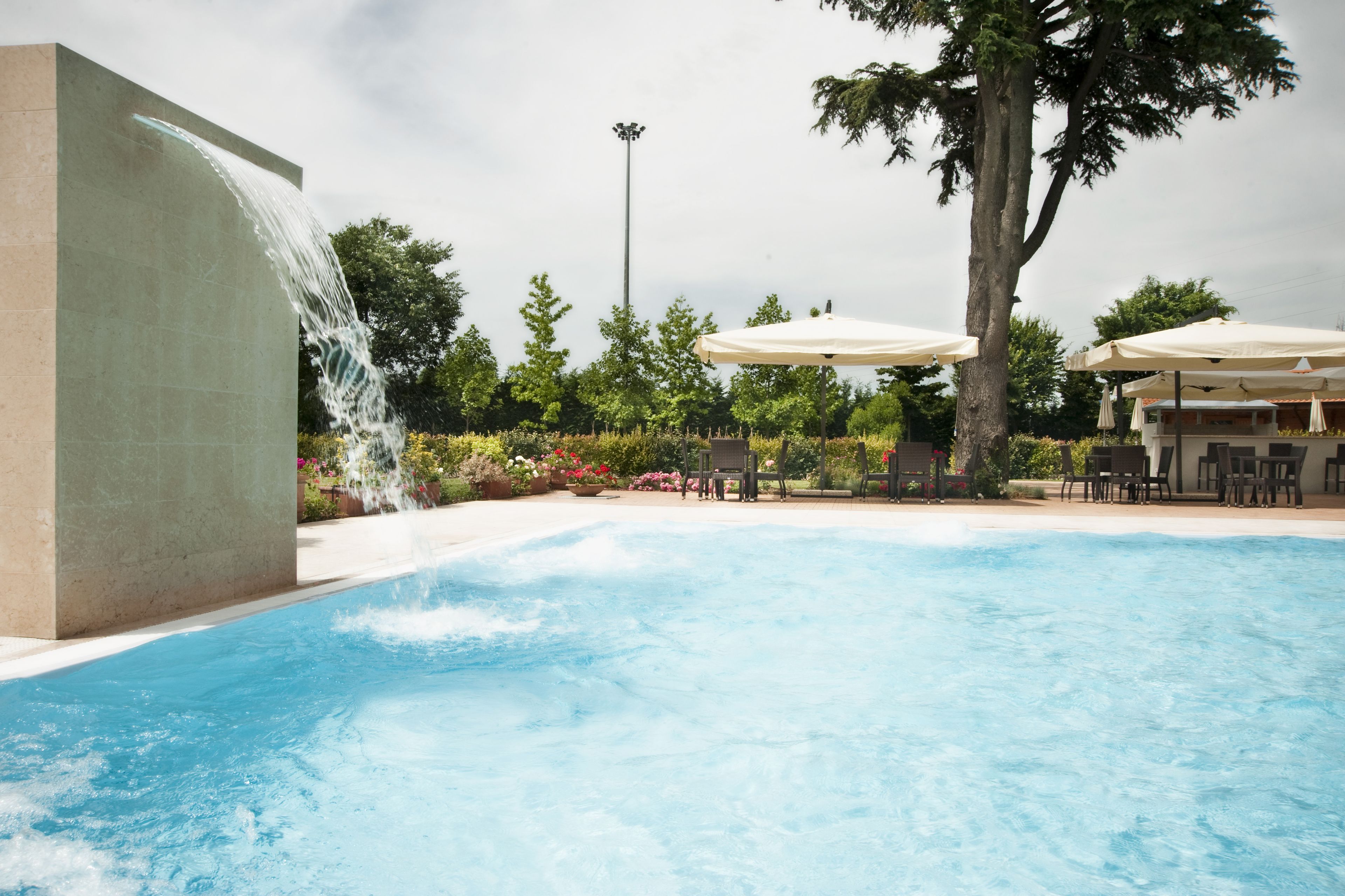 seasonal outdoor pool, open 9 am to 7 pm, pool umbrellas, pool loungers