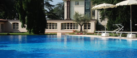 Seasonal outdoor pool, pool umbrellas, pool loungers