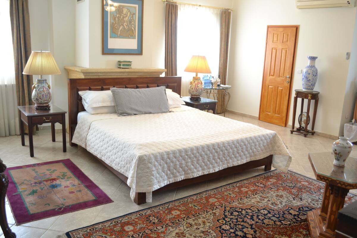 The penthouse Luxury Bedroom with private Terrace and City View | Egyptian cotton sheets, down duvets, pillow-top beds