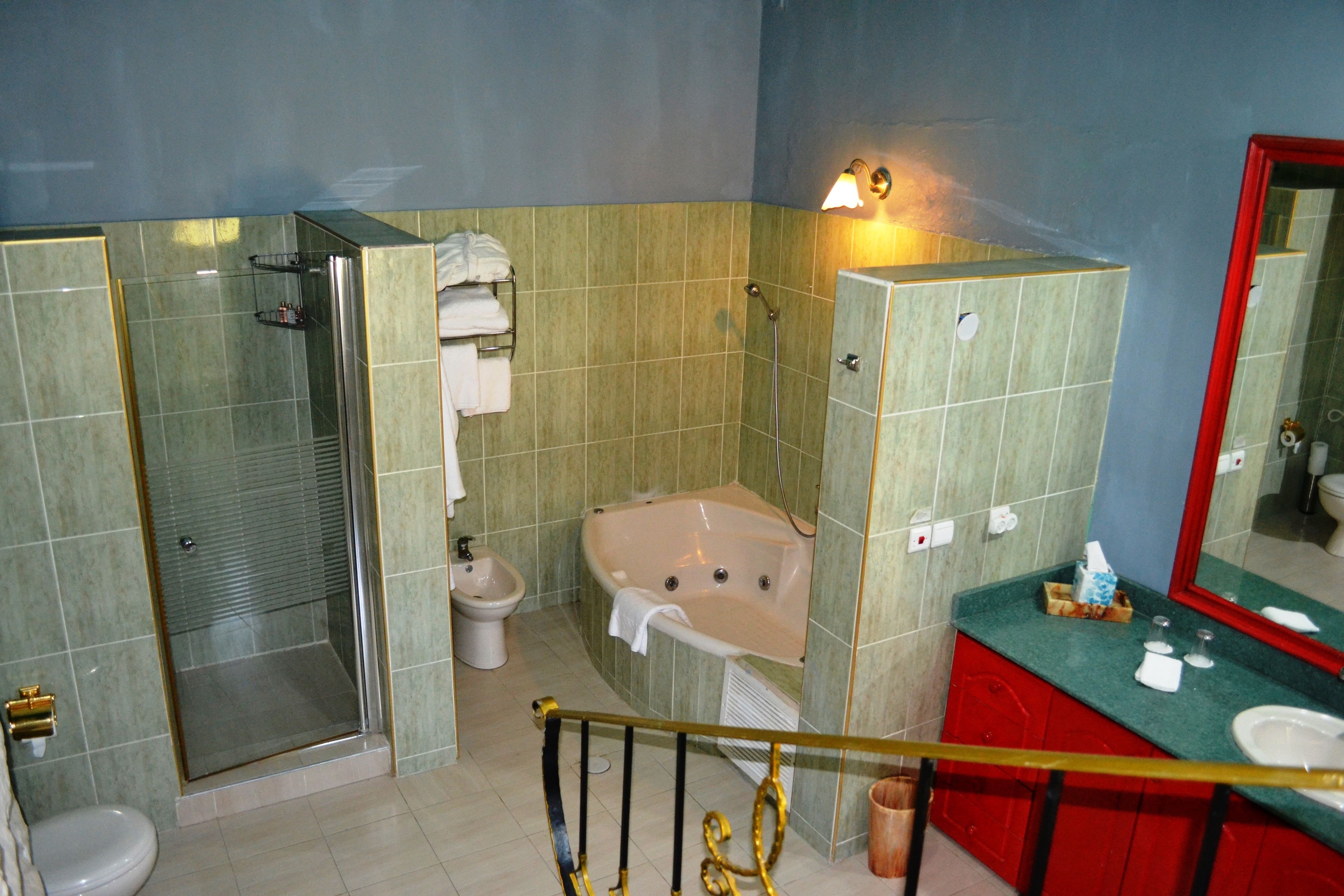 honeymoon penthouse | bathroom | hair dryer, dressing gowns, slippers, towels