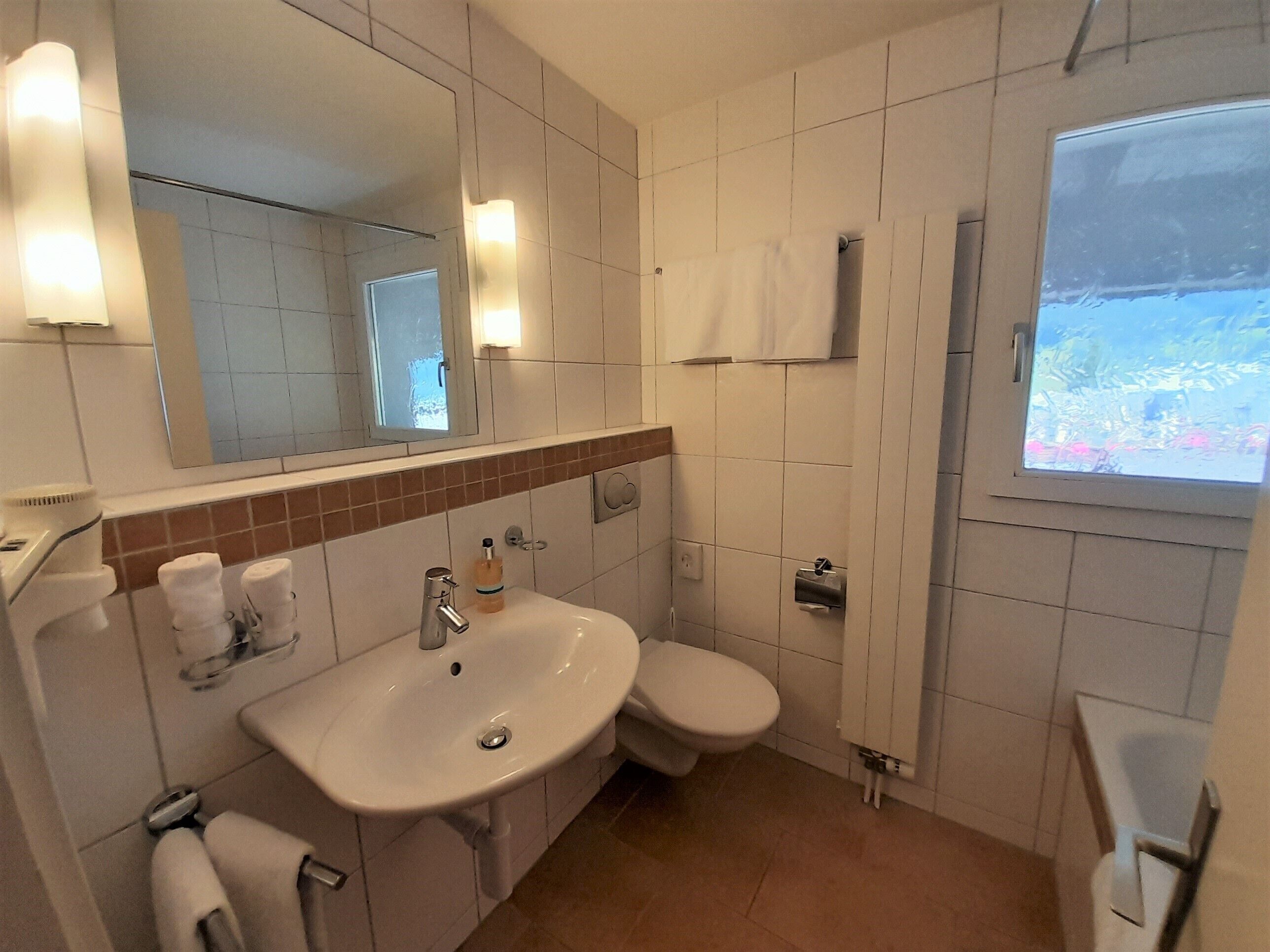 panoramic double room, balcony, mountain view (eiger) | bathroom | free toiletries, hair dryer, towels