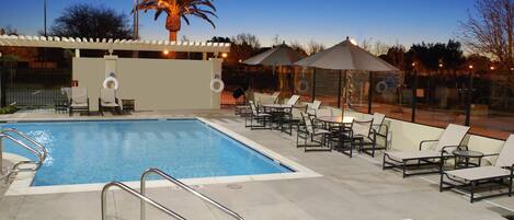 Seasonal outdoor pool, open 7:00 AM to 10:00 PM, pool umbrellas