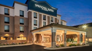 A hotel with a modern design, featuring a prominent sign for Springhill Suites by Marriott.
