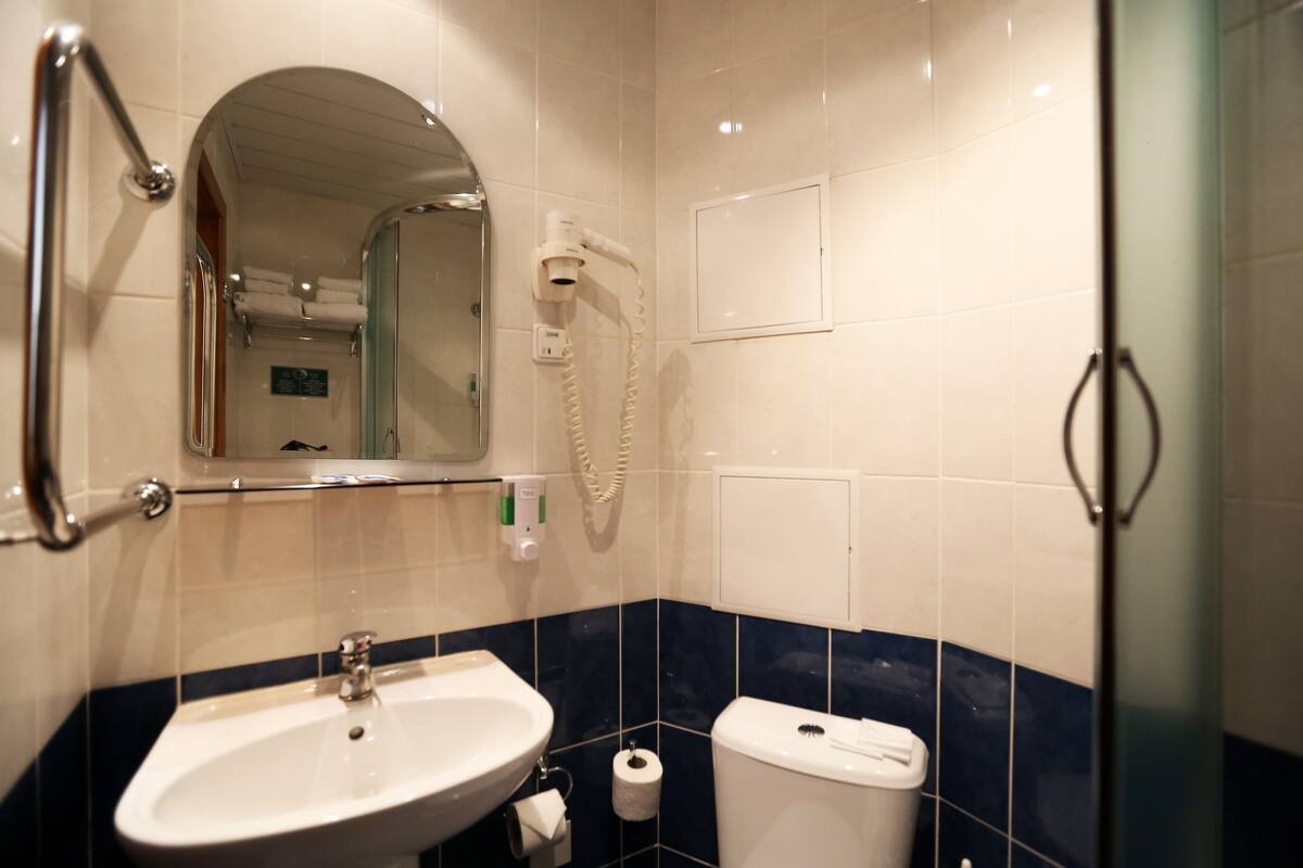 twin room | bathroom | hair dryer, slippers, towels