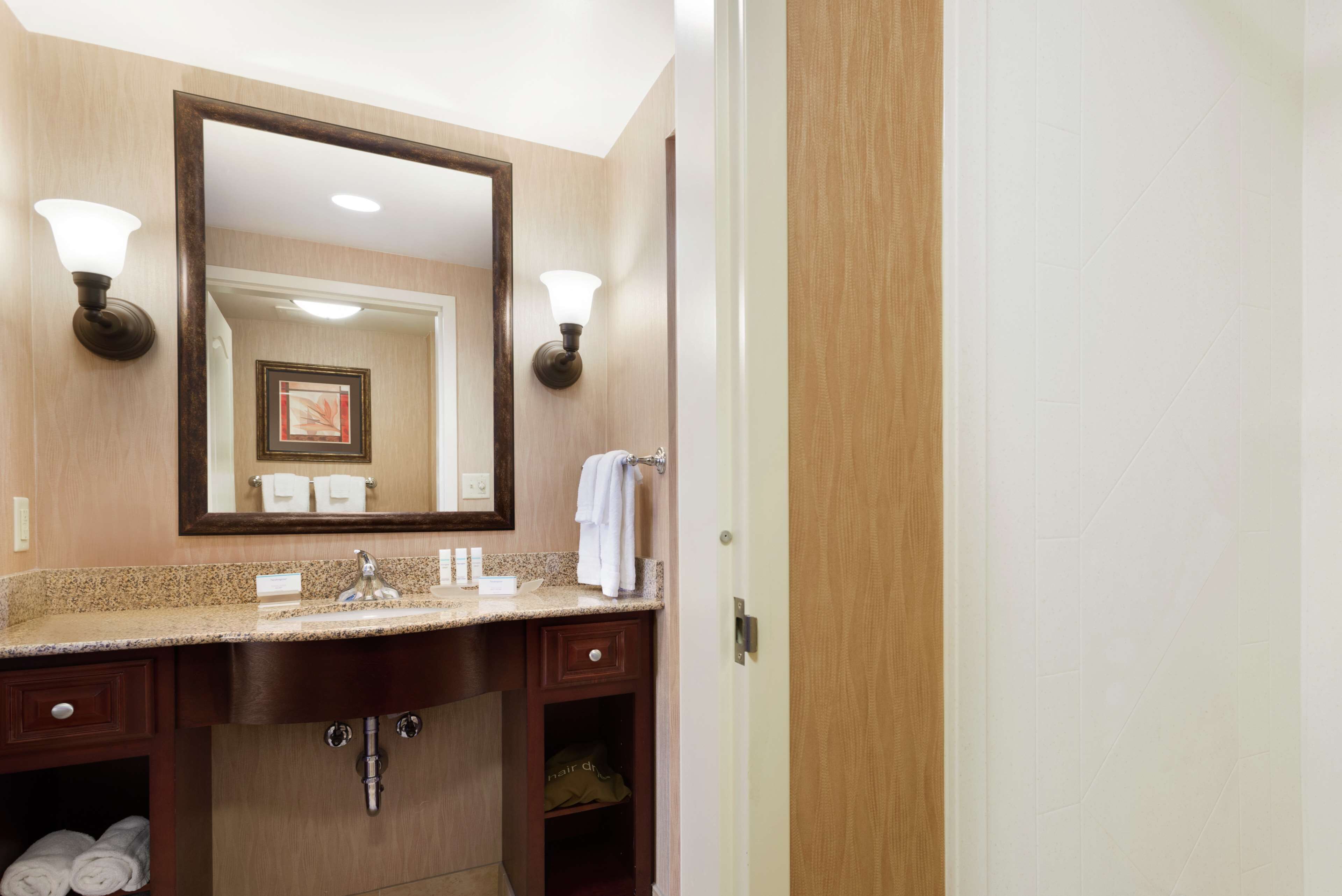 designer toiletries, hair dryer, bathrobes, towels