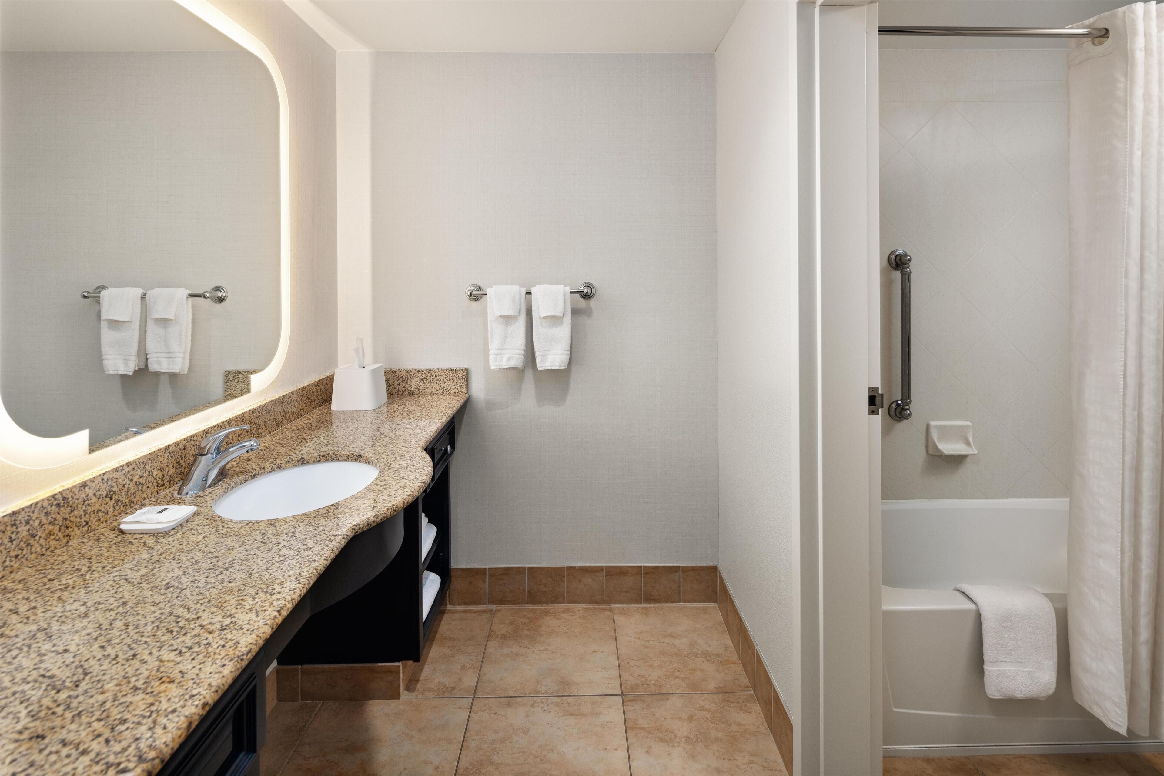 Designer toiletries, hair dryer, bathrobes, towels