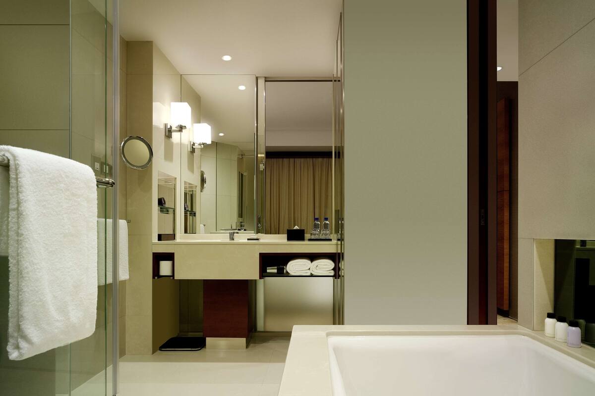 hair dryer, bathrobes, slippers, towels