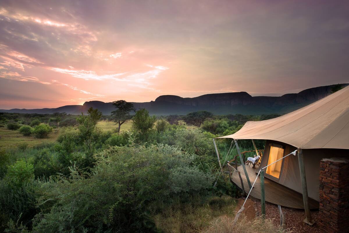 A tented accommodation with a view of the landscape.