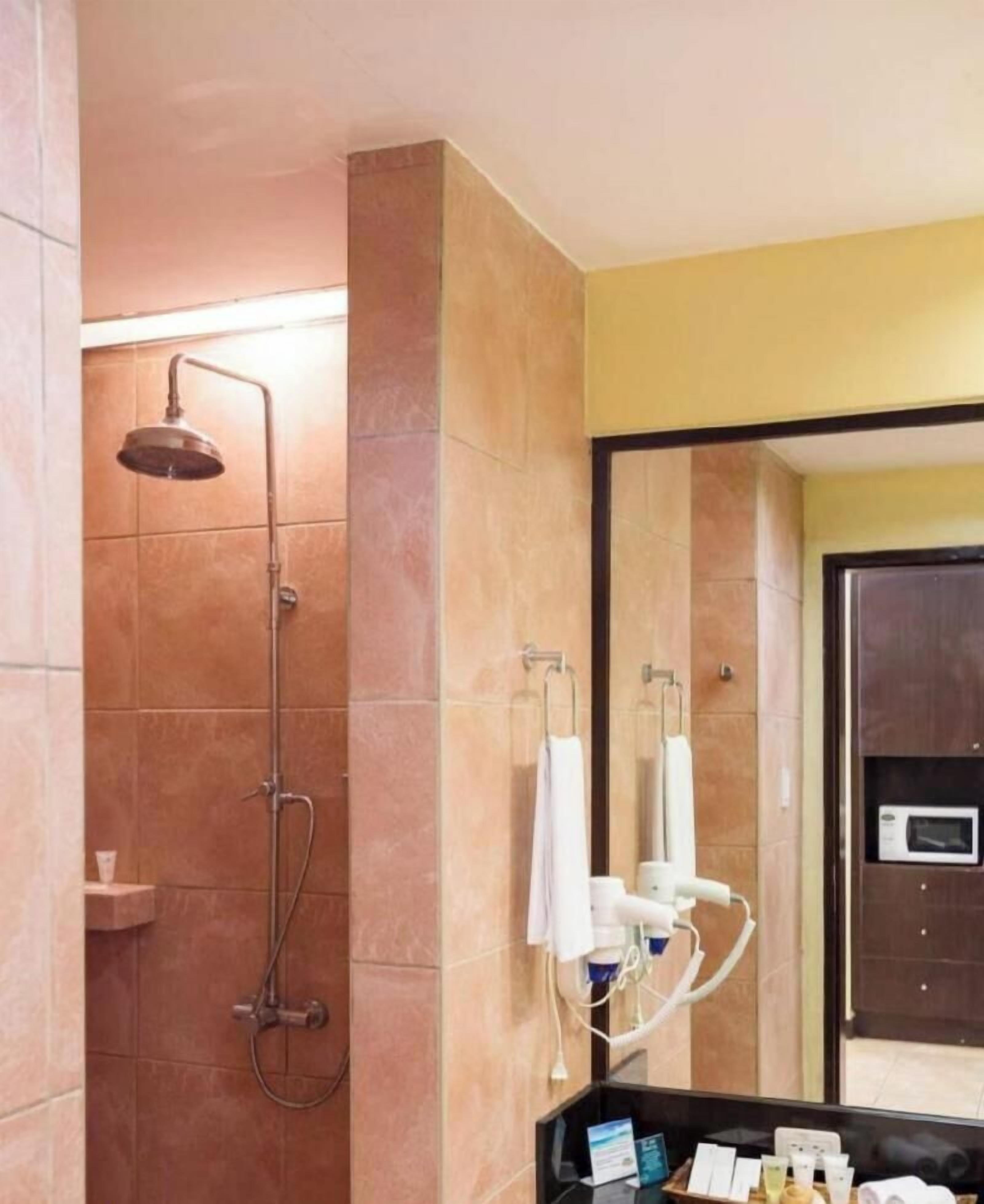 Bathroom | Shower, free toiletries, slippers, towels