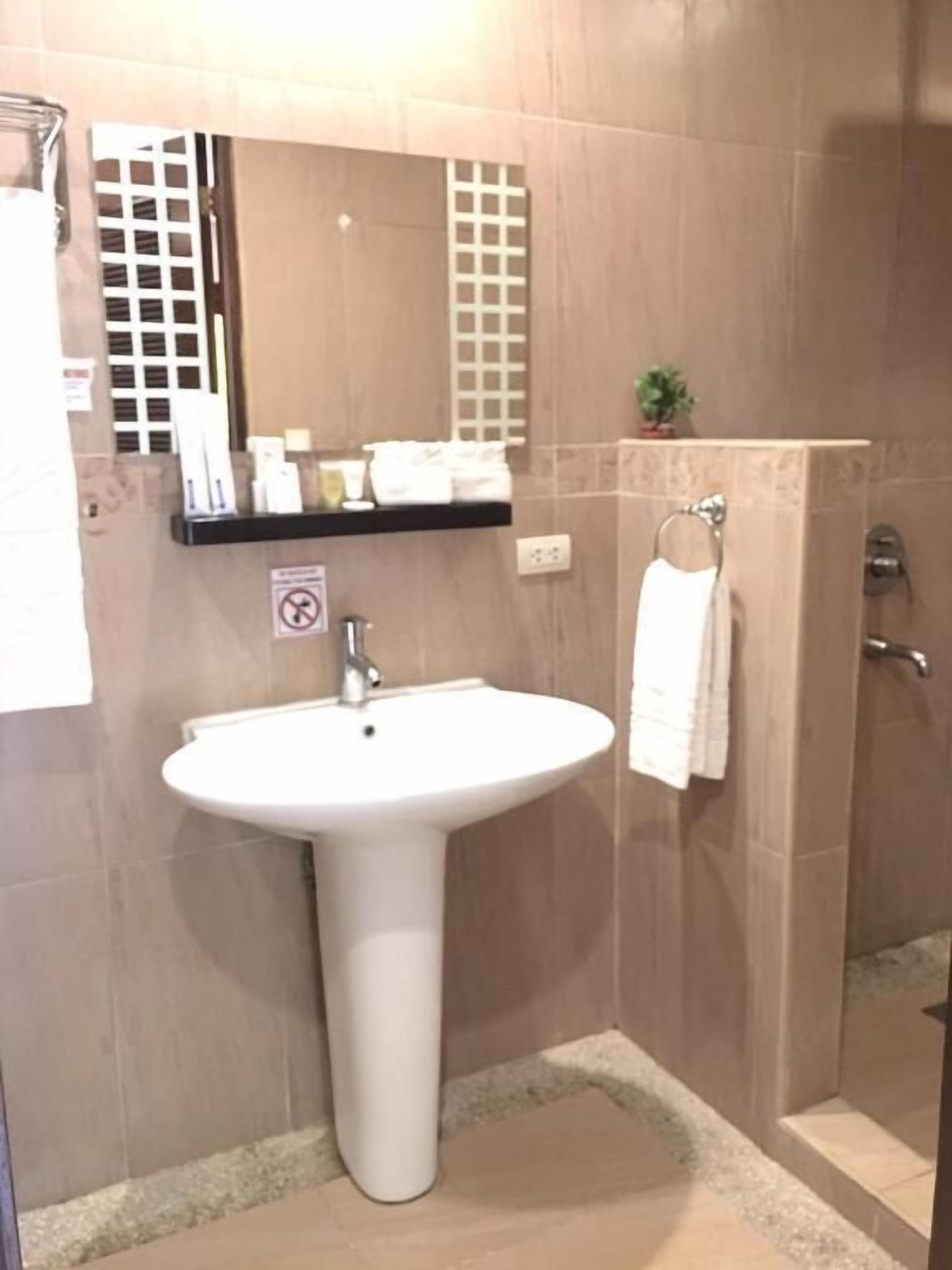 Bathroom | Shower, free toiletries, slippers, towels