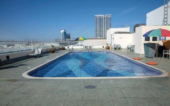 Outdoor pool, pool umbrellas, pool loungers