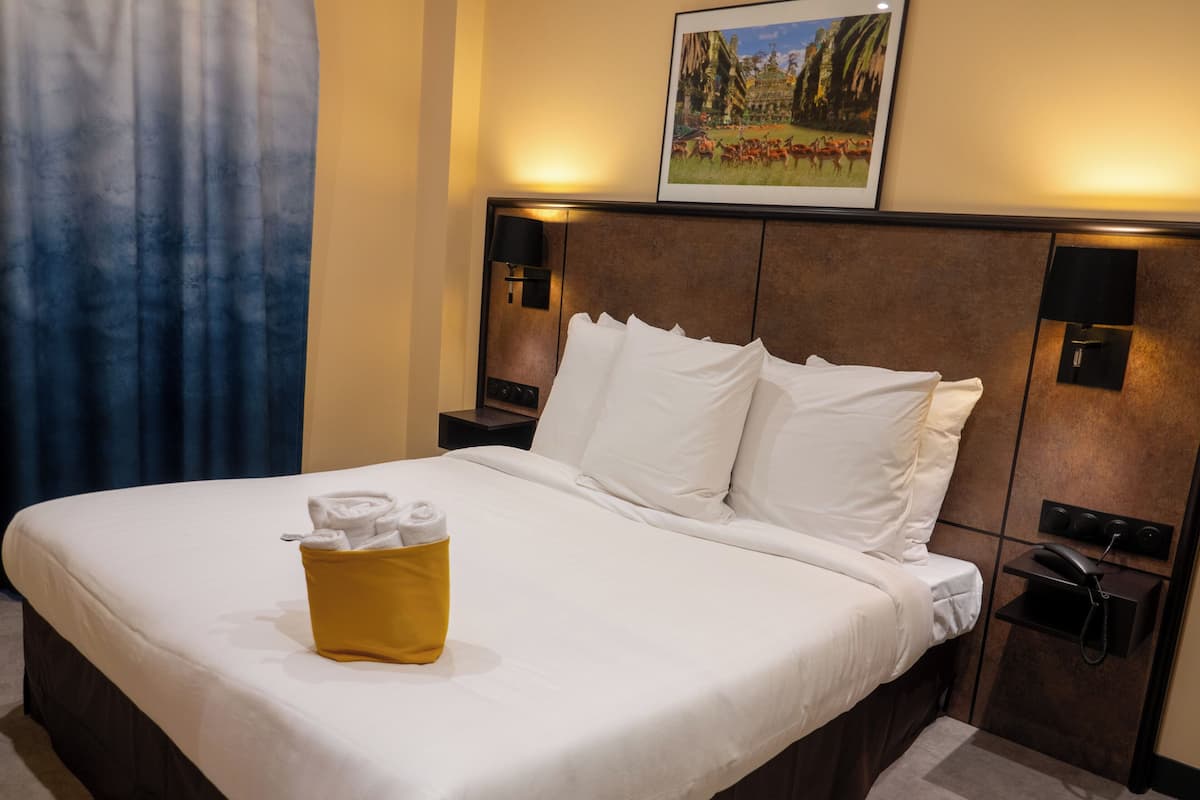 Premium bedding, desk, laptop workspace, soundproofing