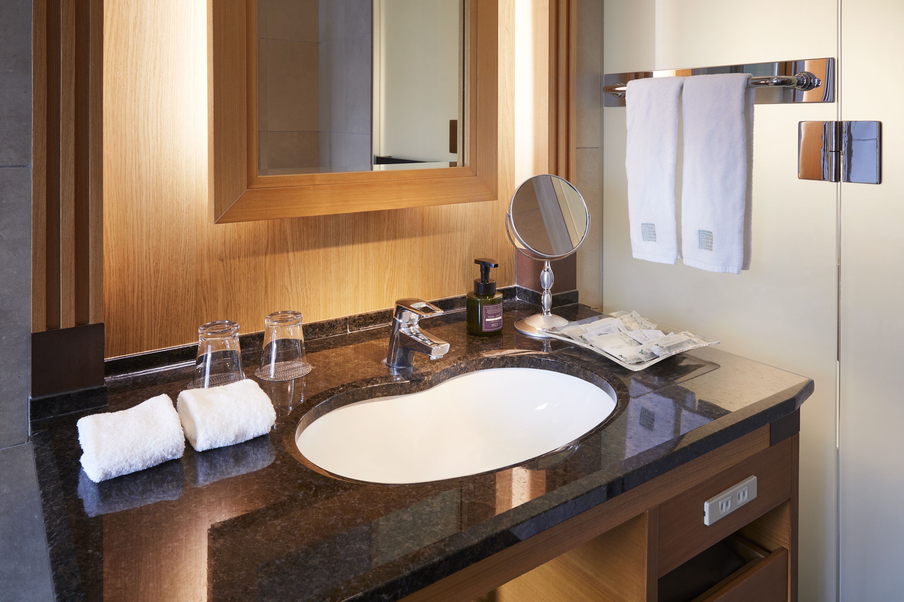 Eco-friendly toiletries, hair dryer, slippers, bidet