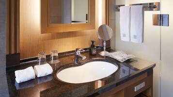 Eco-friendly toiletries, hair dryer, slippers, bidet
