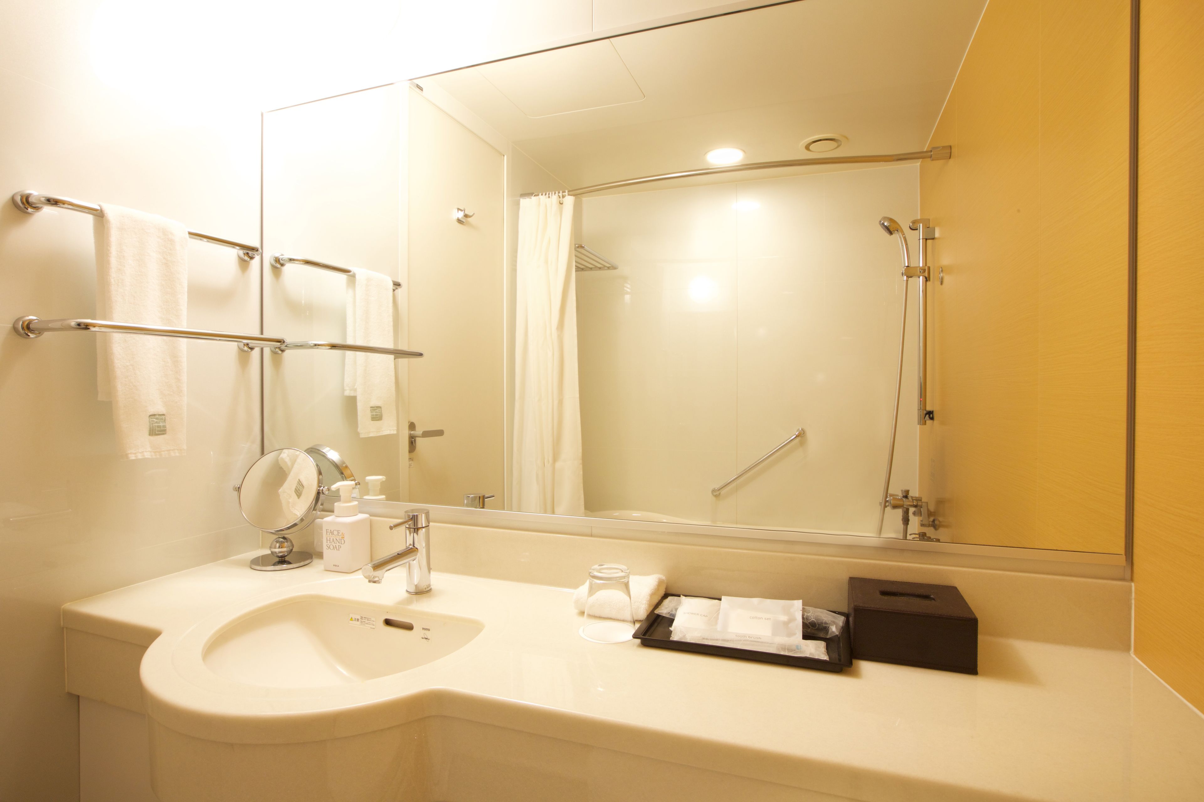 Eco-friendly toiletries, hair dryer, slippers, bidet