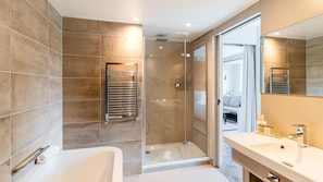 Eco-friendly toiletries, hair dryer, slippers, towels