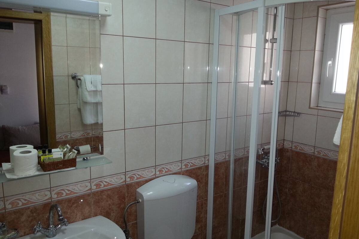 shower, hair dryer, bathrobes, slippers