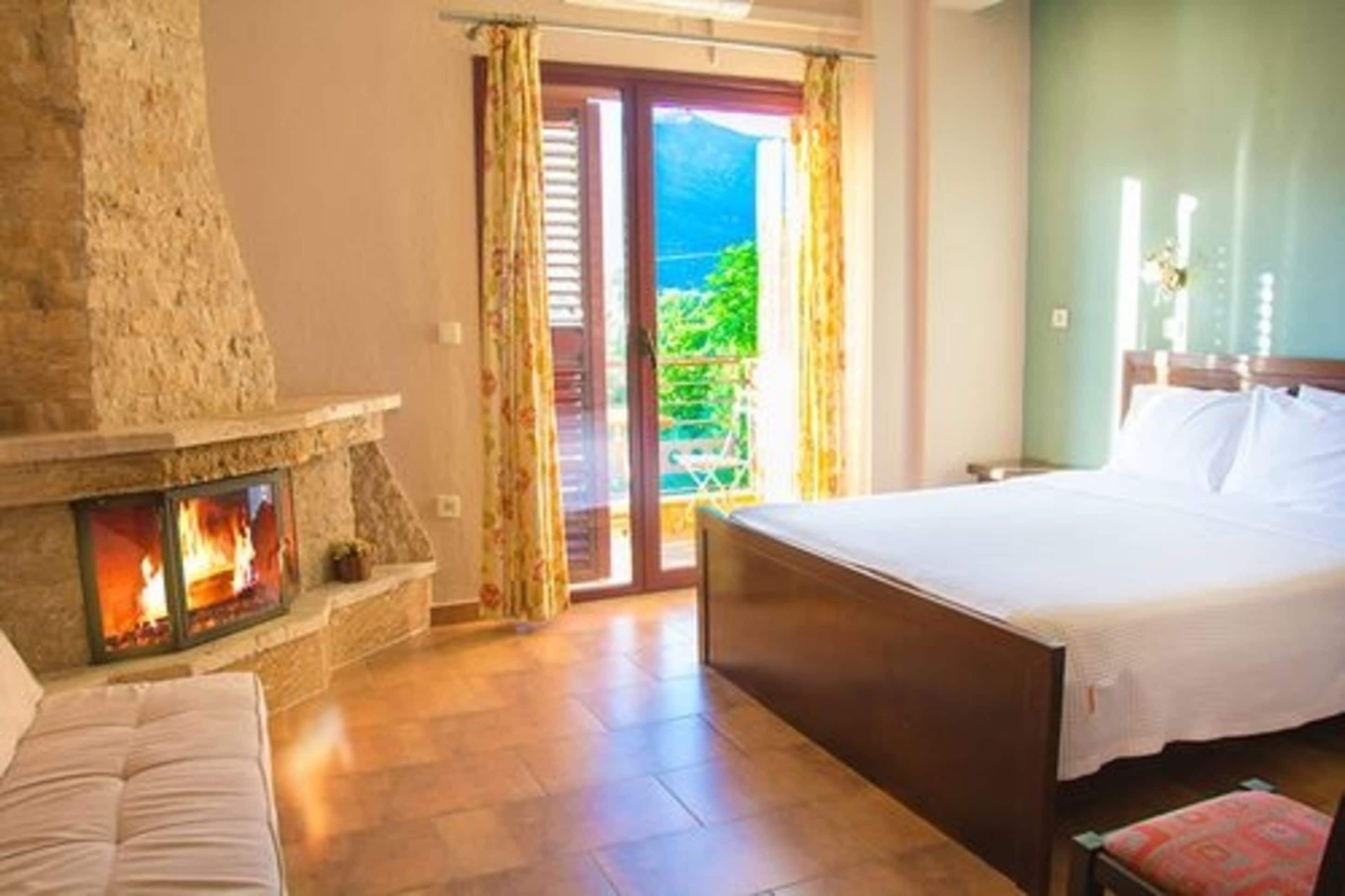 double room, 1 double bed, fireplace, mountain view | 1 bedroom, pillow-top beds, individually decorated, blackout curtains