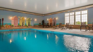 An indoor swimming pool with lounge chairs and beach-themed curtains. - Best Western Plus Liverpool Hotel & Conference Centre (Brooklyn)
