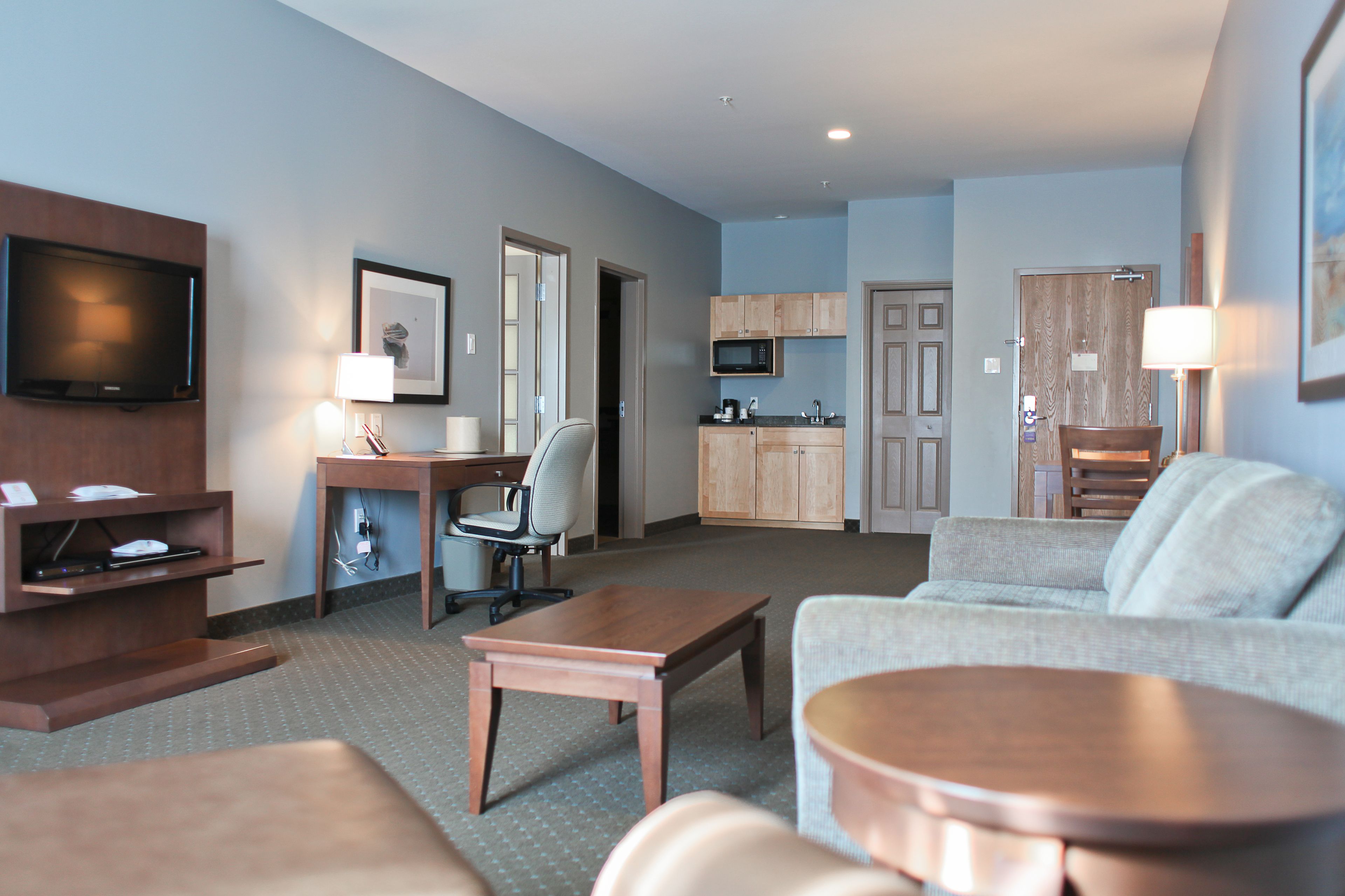 suite, 1 king bed, non smoking, kitchenette (living room;with sofabed) | living area | lcd tv