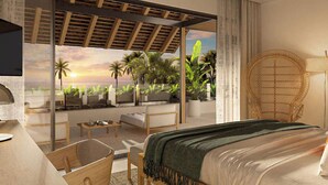 A bedroom with a bed, a desk, a chair, and a view of a balcony with plants and a sunset. - Maradiva Villas Resort & Spa (Flic-en-Flac)