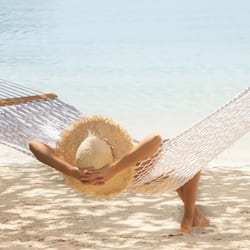 On the beach, white sand, sun loungers, beach umbrellas