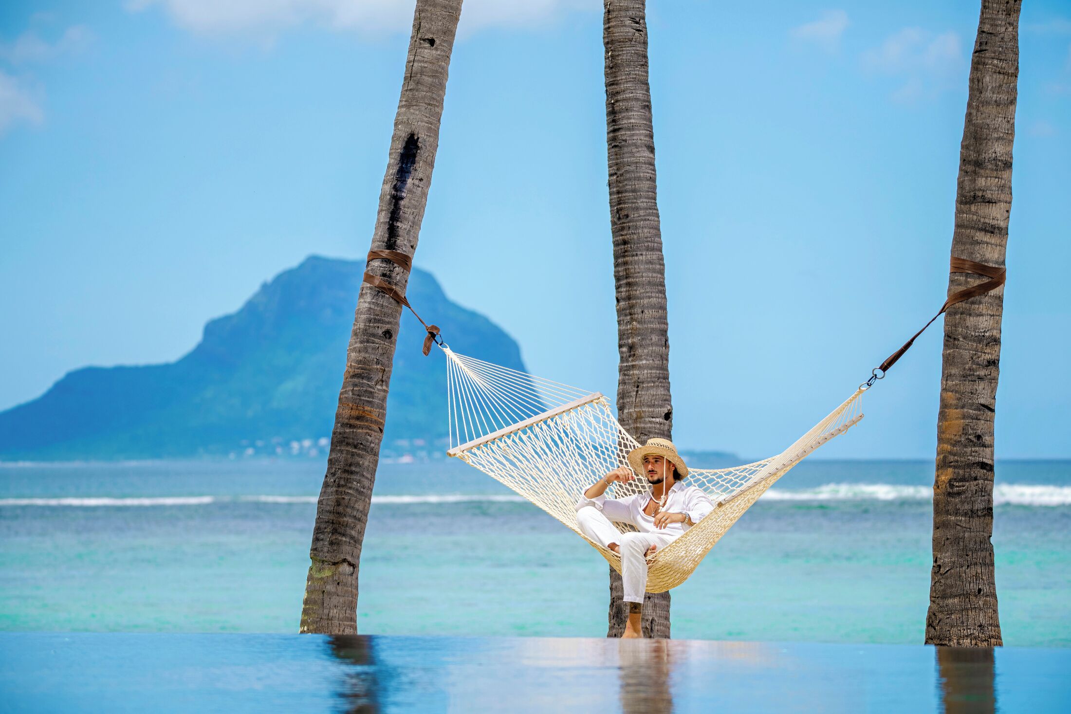 On the beach, white sand, sun-loungers, beach umbrellas