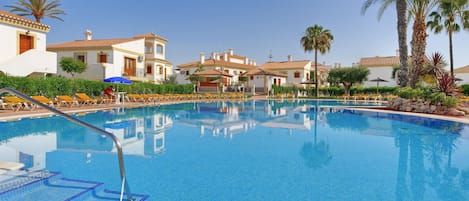 2 outdoor pools, open 10:00 AM to 6:00 PM, pool umbrellas, pool loungers