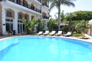 Outdoor pool, open 8:00 AM to 7:00 PM, pool umbrellas, sun loungers