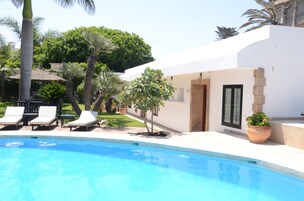 Outdoor pool, open 8:00 AM to 7:00 PM, pool umbrellas, sun loungers