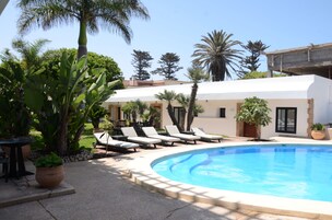 Outdoor pool, open 8:00 AM to 7:00 PM, pool umbrellas, sun loungers